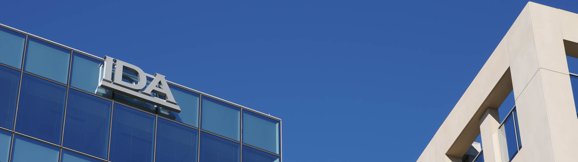 Photo of top of building with IDA logo visible