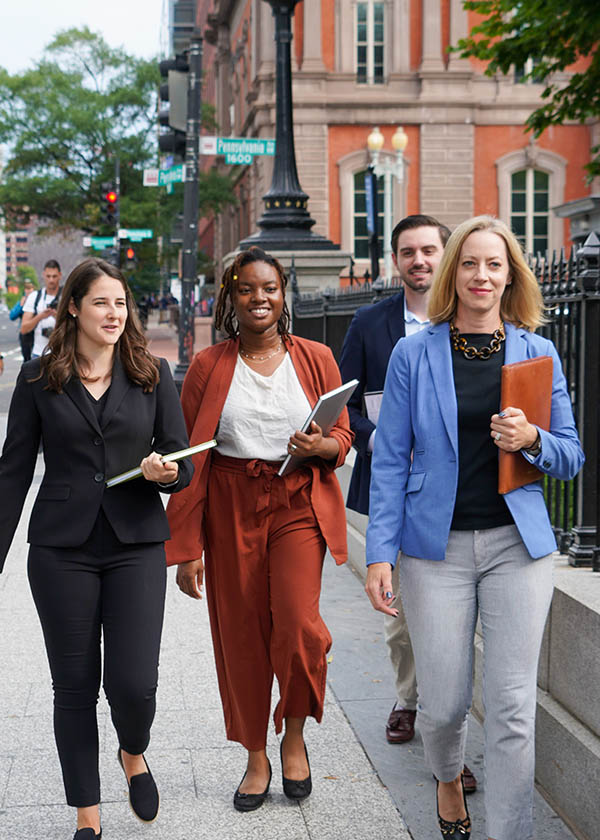 four STPI employees walking