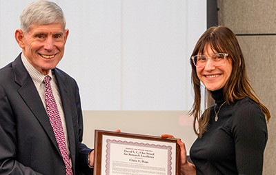Claire Haas (right) receiving Award from IDA President Norty Schwartz